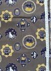 Patterned fabric with cat designs on a gray background, measured by a ruler.