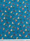 Patterned fabric with animals and flowers on a blue background