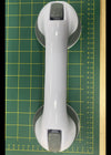 Suction handle for templates when cutting fabric.