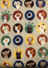 Pattern of cartoon cats in various colors on a beige background