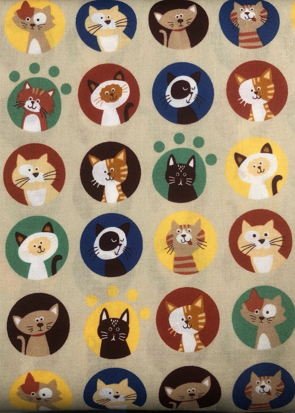 Pattern of cartoon cats in various colors on a beige background